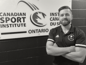 Greg Lewandowski headshot infront of CSIO logo