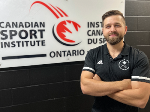 Greg Lewandowski headshot infront of CSIO logo