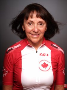 Anna Tykoliz headshot, black background wearing canadian track champions jersey
