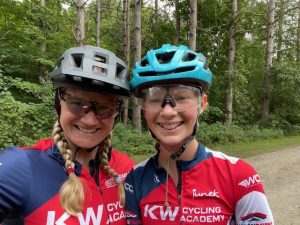 Amy Maher and Addison Marcynuk smiling on a bicycle ride