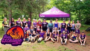 MTB Exchange group photon in forest in front of branded tent