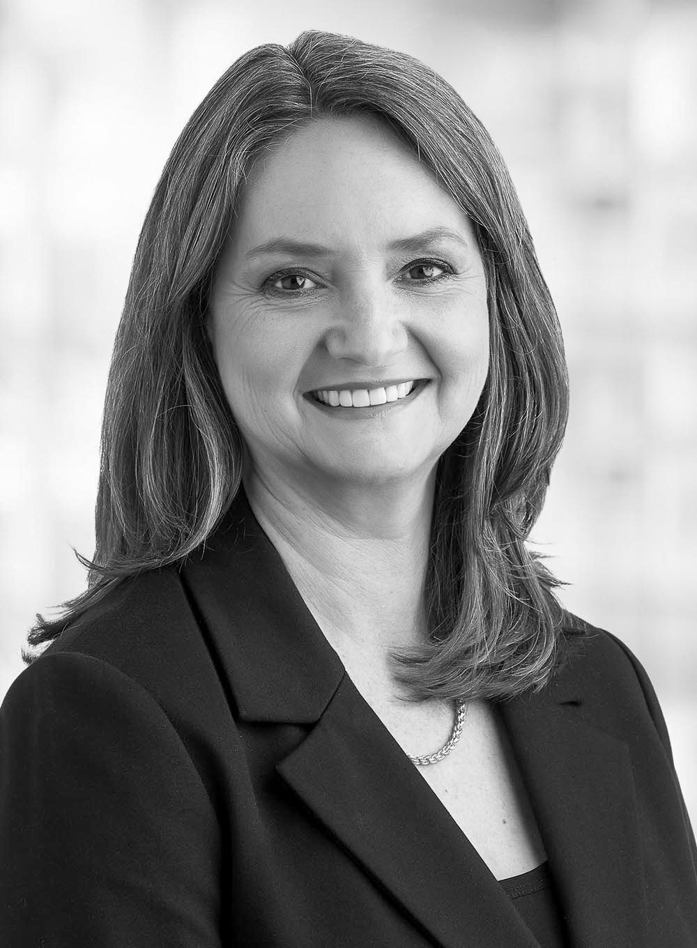 Robin Porter professional headshot, smiling, in business attire
