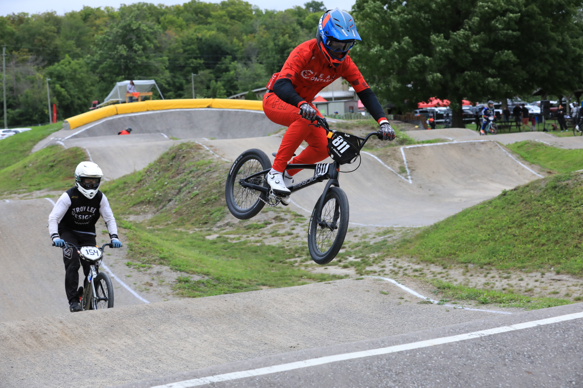 BMX Cyclist airborne wearing Team Ontario Racing Kit.