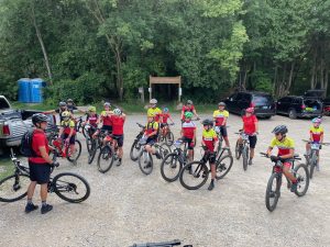 Attack Racing group photo of a group chat ahead of a mountain bike trail ride